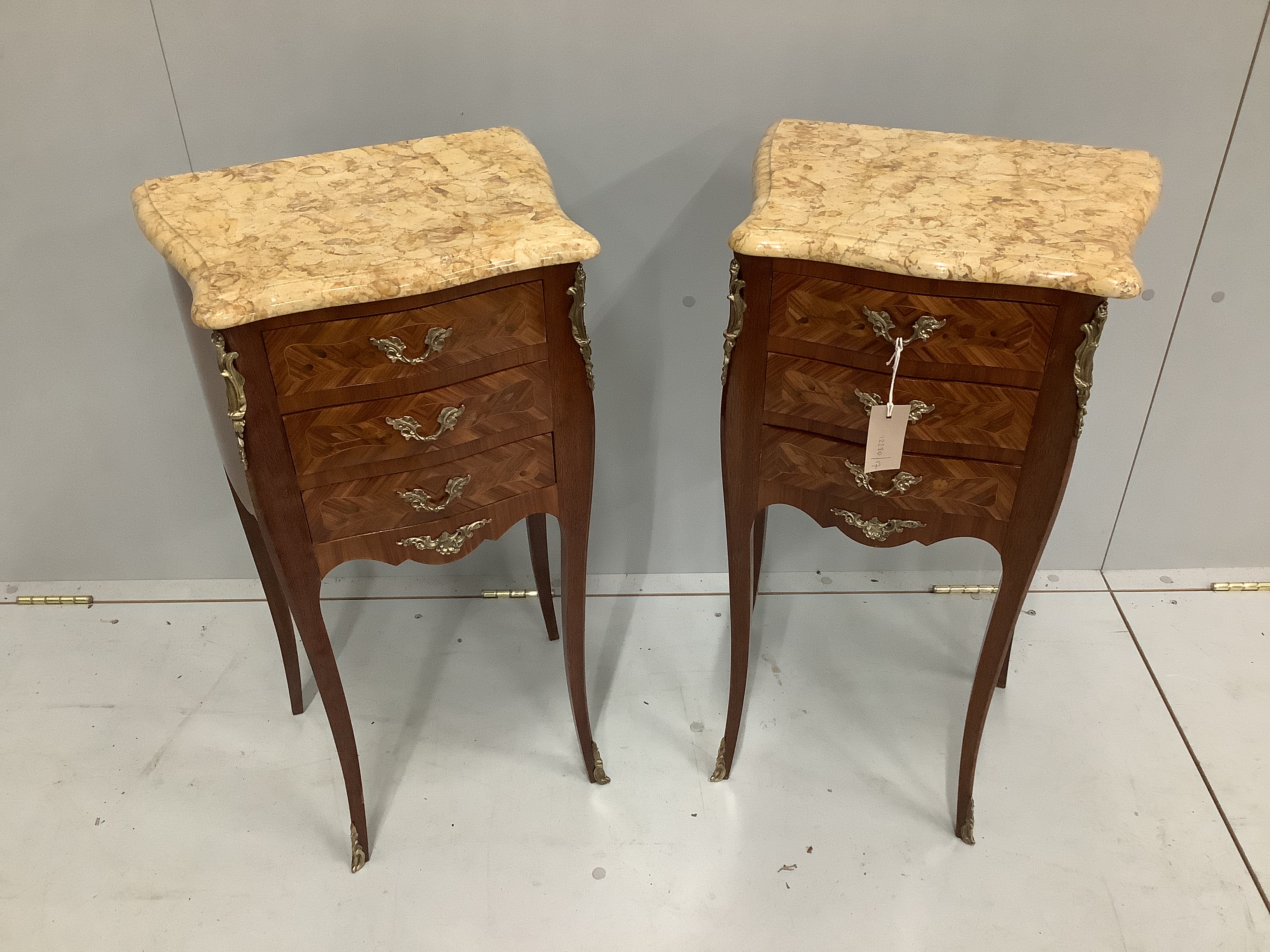 A pair of Louis XV style gilt metal mounted marquetry inlaid kingwood marble topped bedside chests, width 40cm, depth 29cm, height 73cm